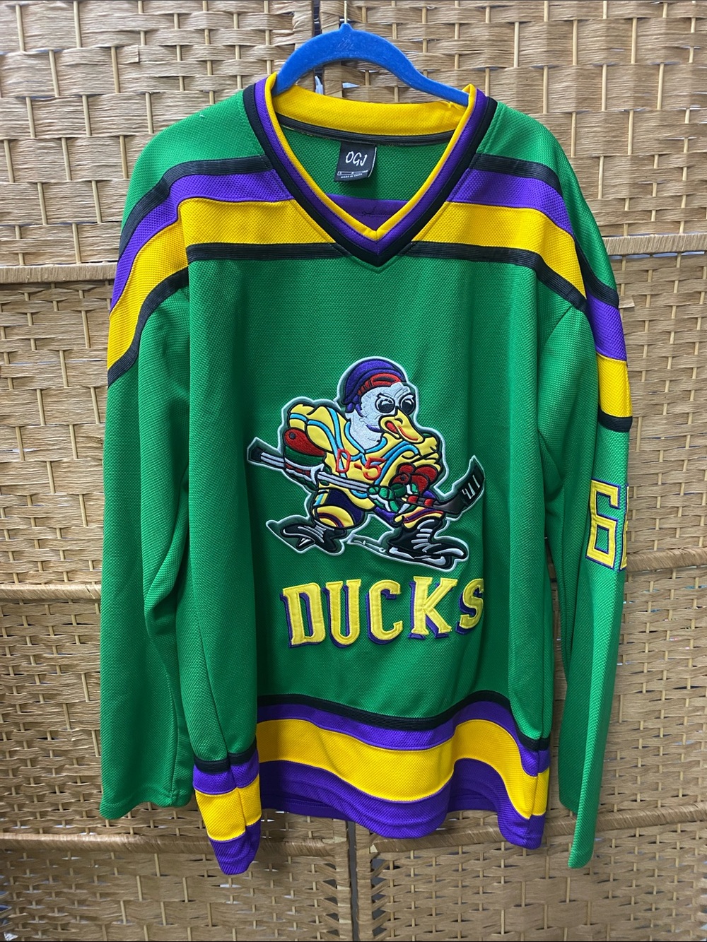 Bombay Green V-Neck Ducks Hockey Sweater with Yellow and Purple Accents